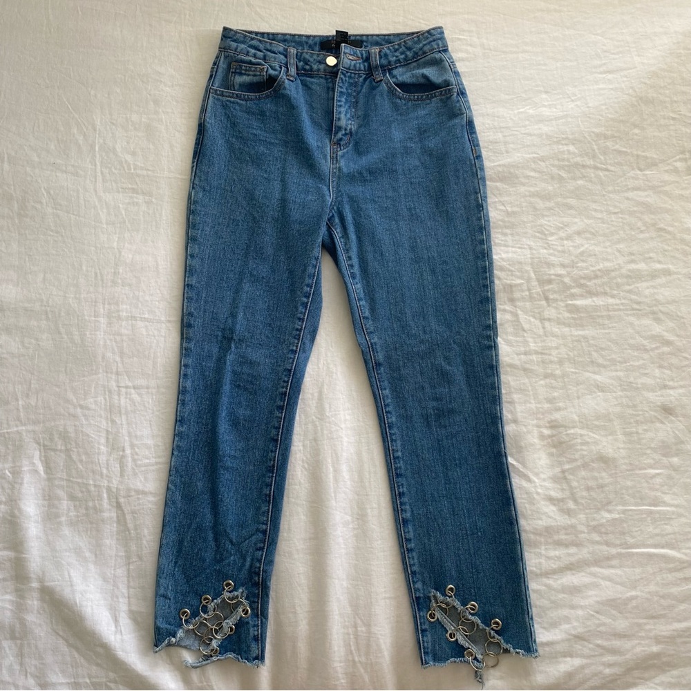 Jeans with chains at the ankle